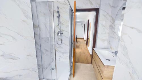 a bathroom with a shower and a sink at Cascais Garden House 101 in Cascais