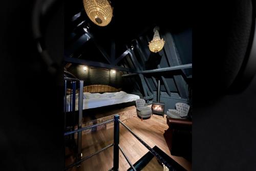 a view of a room with a bed and lights at Domaine 10 in Schore