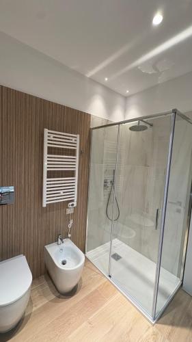 a bathroom with a shower and a toilet and a sink at Affittacamere Nonna Maria in Foggia