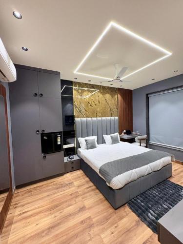 a bedroom with a large bed in a room at Hotel Starway in Hisār