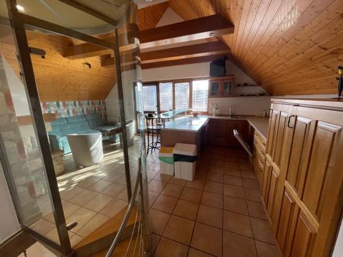 an overhead view of a kitchen with wooden ceilings at Vinný sklep Tesařík in Prušánky