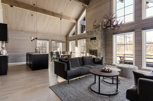 a living room with a couch and a table at Röningen 24 - Bruksvallarna in Bruksvallarna