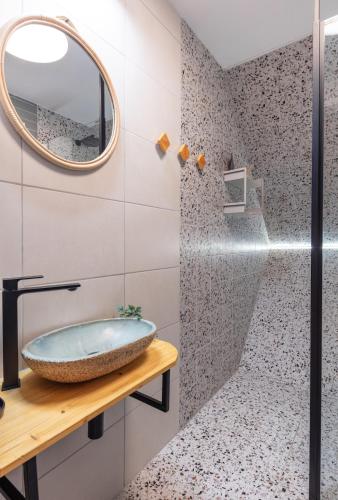 a bathroom with a sink and a mirror at Cabin Balaton in Vonyarcvashegy