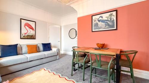 a living room with a couch and a table at Britannia Apartments in Liscard Village Wallasey by Rework Accommodation in Wallasey