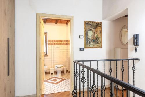 a staircase leading to a bathroom with a toilet at Italian Experience-Casale Dolcemare in Campofilone