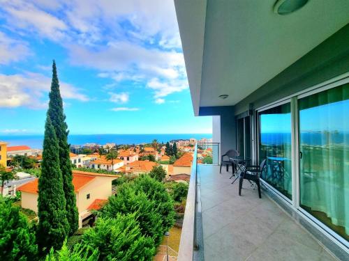 a balcony with a view of the ocean at Spacious Summer Fresh Family Apartment with Panoramic Sea Views in Funchal in Funchal