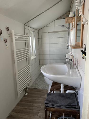 a bathroom with a sink and a mirror at house46-1 in Hohen Neuendorf