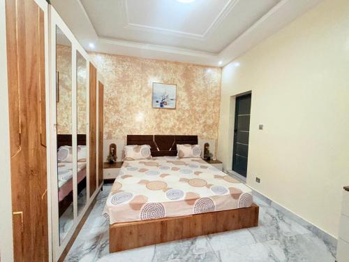 a bedroom with a large bed in a room at House & Food in Thiès