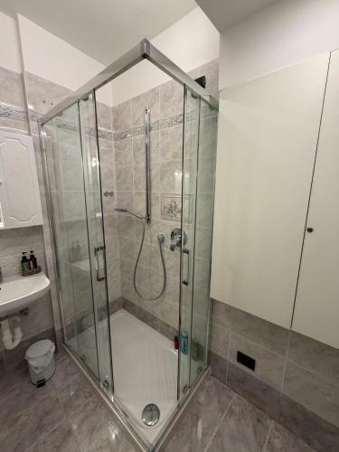 a shower with a glass door in a bathroom at Suite romantica a Como Centro in Como