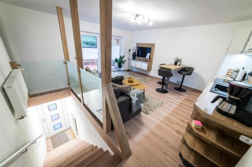 a living room with a couch and a table at Ferienwohnung TaJoLe in Heinade