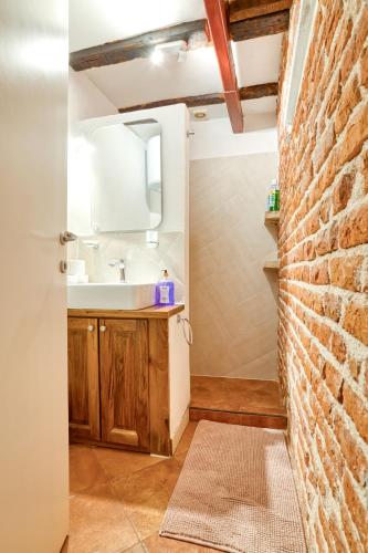 a bathroom with a sink and a mirror at Best view! Rooftop with Garden - Old Town Nr404 in Kotor