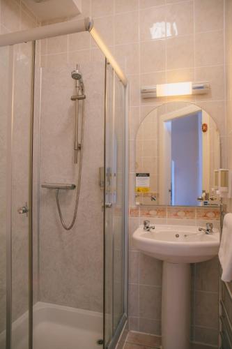a bathroom with a shower and a sink at Inn at Ardgour in Onich