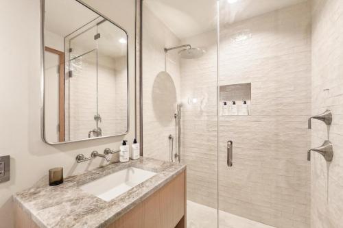 a bathroom with a sink and a shower at Offshore Spa & Residences in Montauk