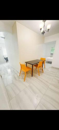 a dining room with a table and two chairs at Omaha Wynwood in Miami