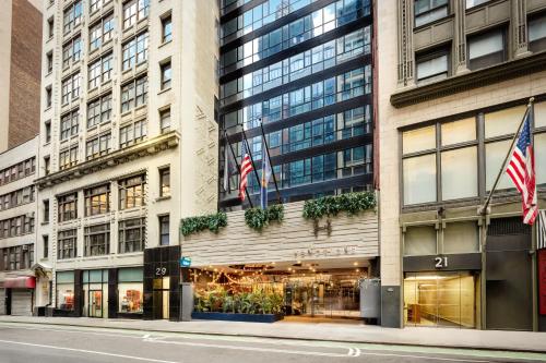 a building with two american flags in front of it at Hotel Hendricks in New York