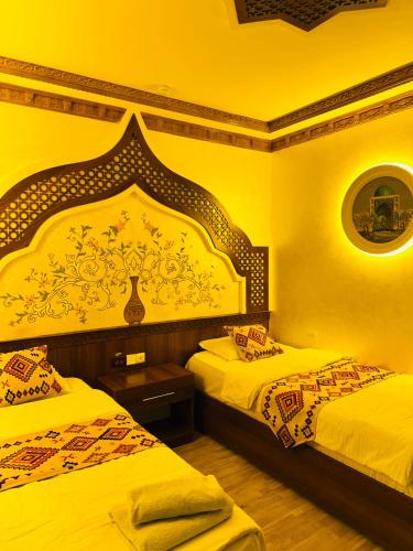 Llit o llits en una habitació de Khiva Minor
