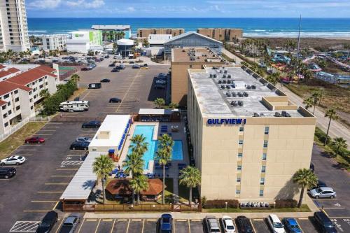 an aerial view of a building with a parking lot at Beach Access Condo with Pool, Hot Tub Area & BBQ - Gulfview I - unit 213 in South Padre Island