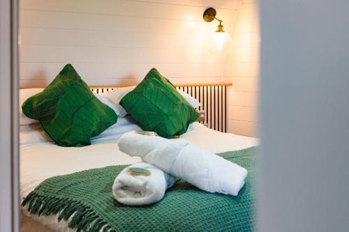a bed with a stuffed animal on top of it at Pheasant Lodge in Little Bytham