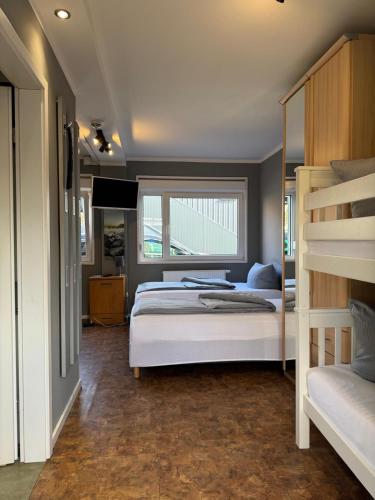 a bedroom with a bunk bed and a ladder at Motel Home Berlin in Berlin