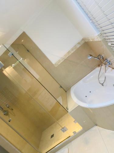 a bathroom with a sink and a toilet at De Ocean Lane Guest House in Cape Town
