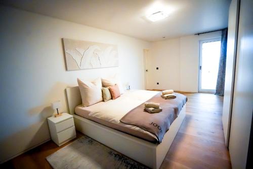 a bedroom with a bed in a room at RheinView Residence - Apartment in Mainz