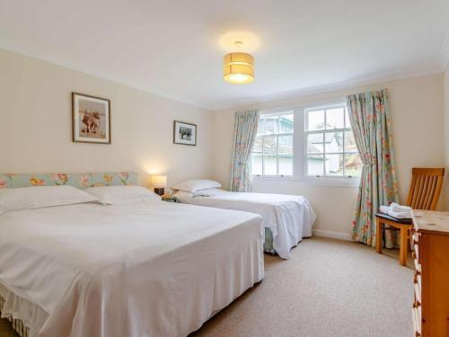 a bedroom with two beds and a window at 6 Bed in Dunkeld oc-ca145 in Riechip