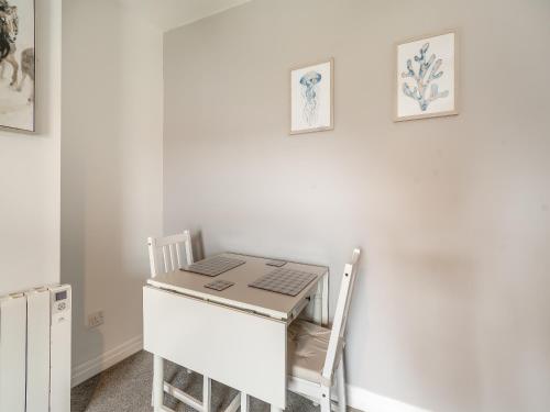 a desk with a laptop on it in a room at Bluebell Apartment - Uk42381 in Bridlington