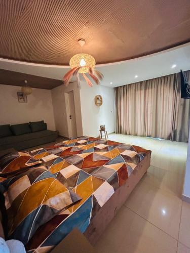 a bedroom with a large bed in a room at Hobbitul lui Maș in Valea lui Maş