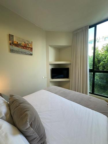 Llit o llits en una habitació de H7 TLV
