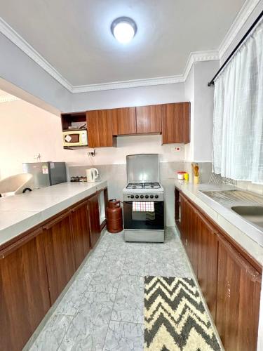 Cuina o zona de cuina de Queens Stay 2Br