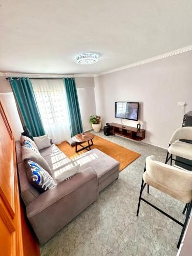 Zona d'estar a Queens Stay 2Br