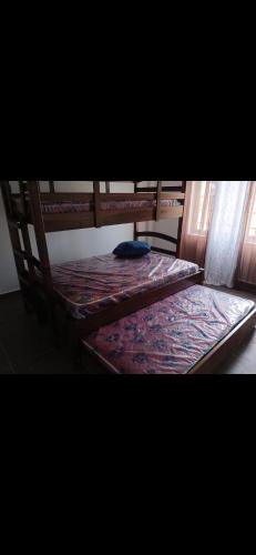 a pair of bunk beds in a room at Boca de viento Chica in Chicá