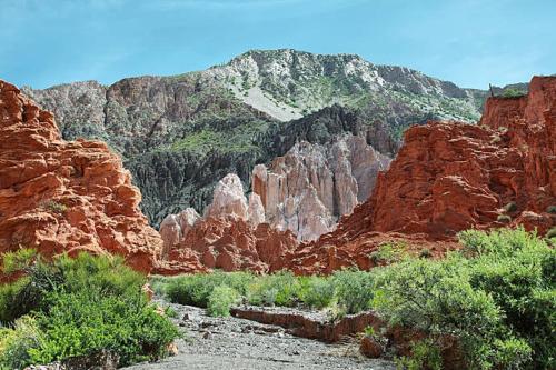 a view of a canyon with some rocks and bushes at Wally wally 2 in Senador Pérez