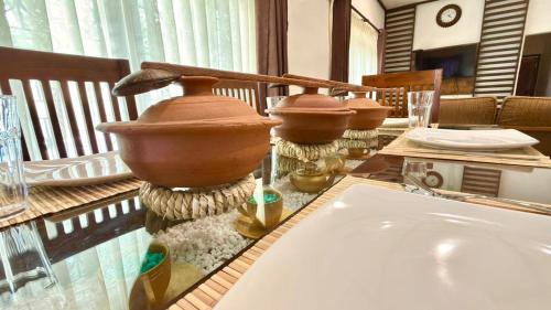a bathroom counter with a sink and twoentedents on it at Abbi Holiday Entire Private Villa with Swimming Pool - jaffna town in Jaffna