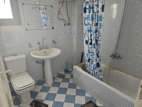 a bathroom with a sink and a toilet and a shower at Modern Luxury Villa Steps from the Sea North Coast in Borg El Arab