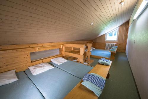 a room with two beds in a sauna at juhui Lenzerheide in Lenzerheide