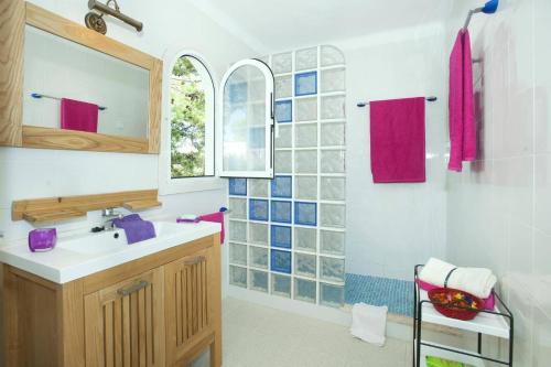 a bathroom with a sink and a mirror at Villa Reco by Villa Plus in Felanitx