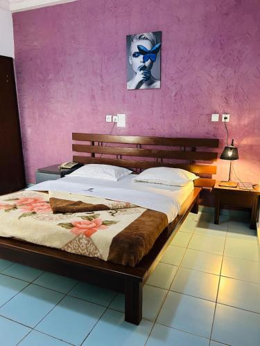 Llit o llits en una habitació de Prodiges Hôtel