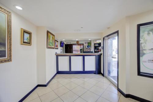 a hallway with a bar in a pharmacy at Texas Inn Brownsville by Hotel O in Brownsville