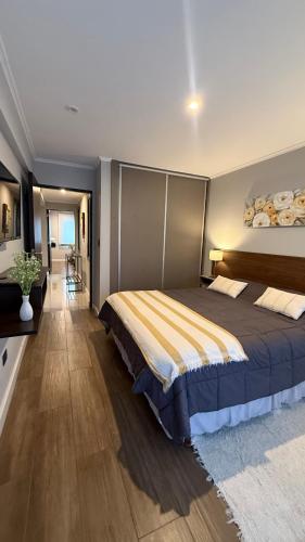 a bedroom with a large bed in a room at Ballester's Dream in San Martín de los Andes