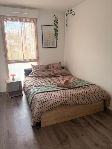 a bedroom with a bed with a hat on it at DAKEY home - Disneyland Paris, Village Nature in Magny-le-Hongre