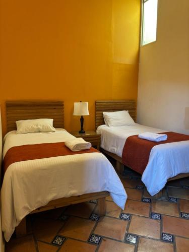 Krevet ili kreveti u jedinici u okviru objekta Hotel Integra Tepoztlán