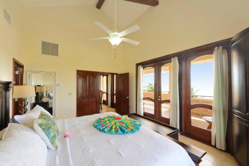 a bedroom with a white bed with a pillow on it at Seiri del Mar in Hopkins