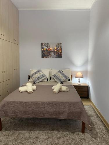 a bedroom with a large bed with two pillows at Vacation Home in Myrina
