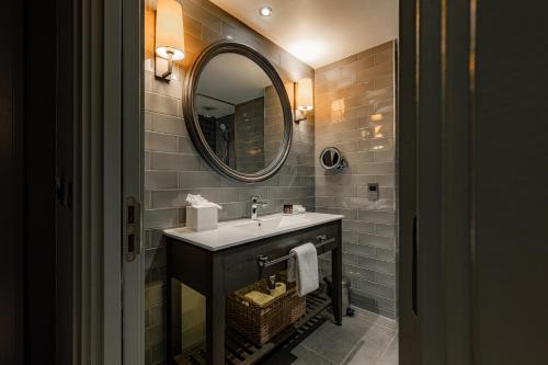a bathroom with a sink and a mirror at Dakota Manchester in Manchester