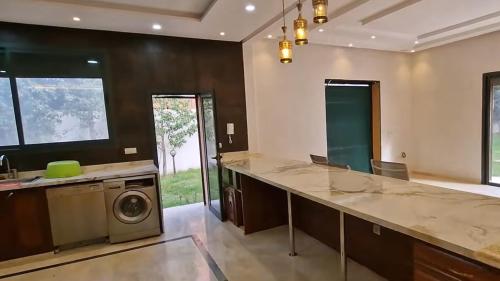 a large laundry room with a washer and dryer at Prestige Villa in Marrakesh