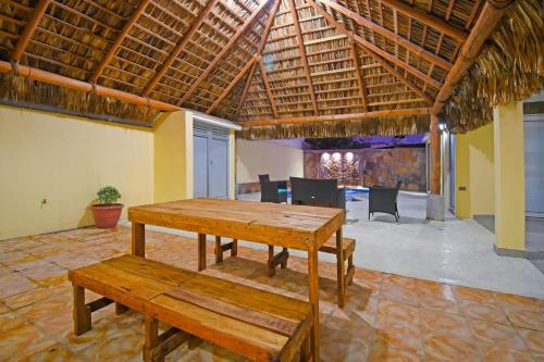 a dining room with a wooden table and chairs at Poolside Retreat Lounge Parking Near Downtown in La Paz