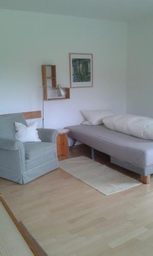 a living room with two beds and a couch at Ferienwohnung Wiesengrund in Überlingen
