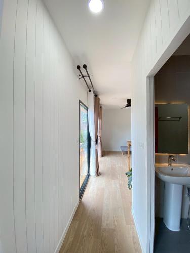 a hallway of a house with a sink and a bathroom at Aonang Green Tree in Ao Nang 