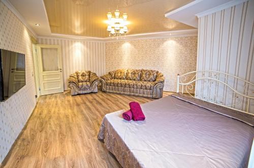 A bed or beds in a room at Apartments on Svobody Avenue- the center of Lviv
